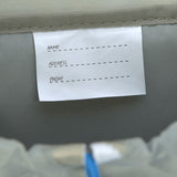 A close up of the name tag on the Lassig kids mini outdoor backpack.