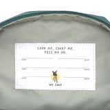 The inside label of the Lassig mini backpack for kids in a dark green colour, with multiple spaces for names and addresses so the bag can be passed on to younger siblings and friends.
