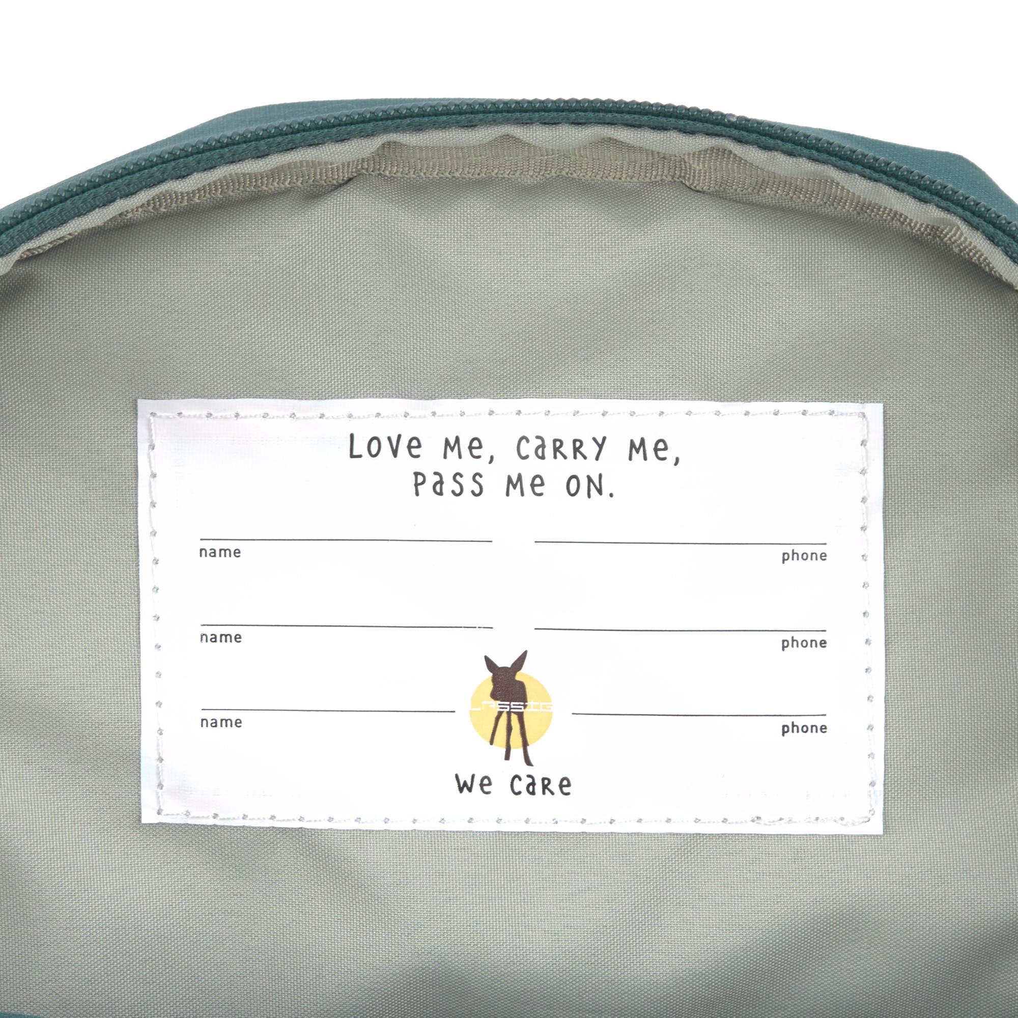 The inside label of the Lassig mini backpack for kids in a dark green colour, with multiple spaces for names and addresses so the bag can be passed on to younger siblings and friends.