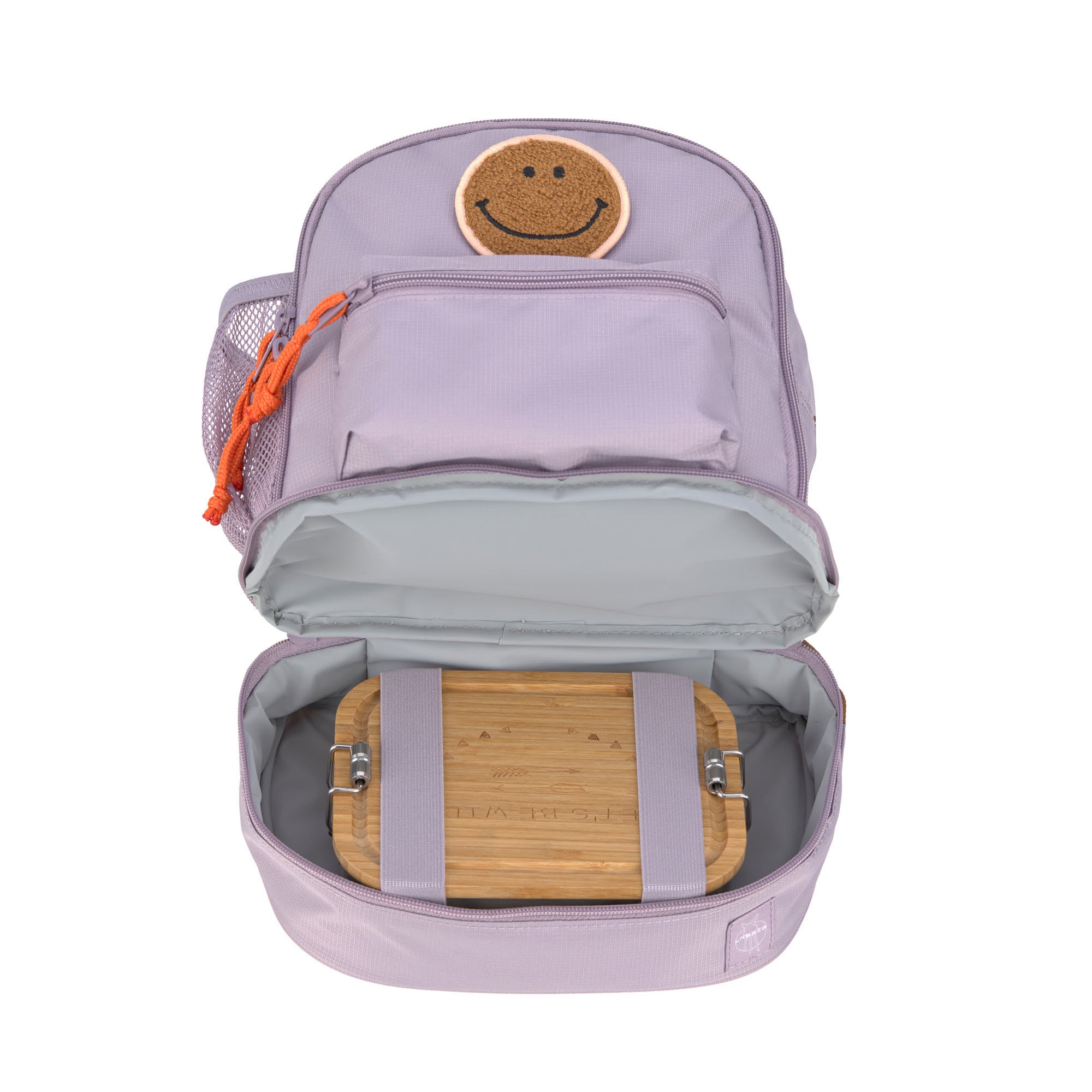 The Lassig mini kids backpack in a lilac colour, with the bottom zippered compartment open to show that you can use it to store a lunch box.