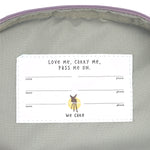 The inside label of the Lassig mini kids backpack with multiple spaces for names and phone numbers.