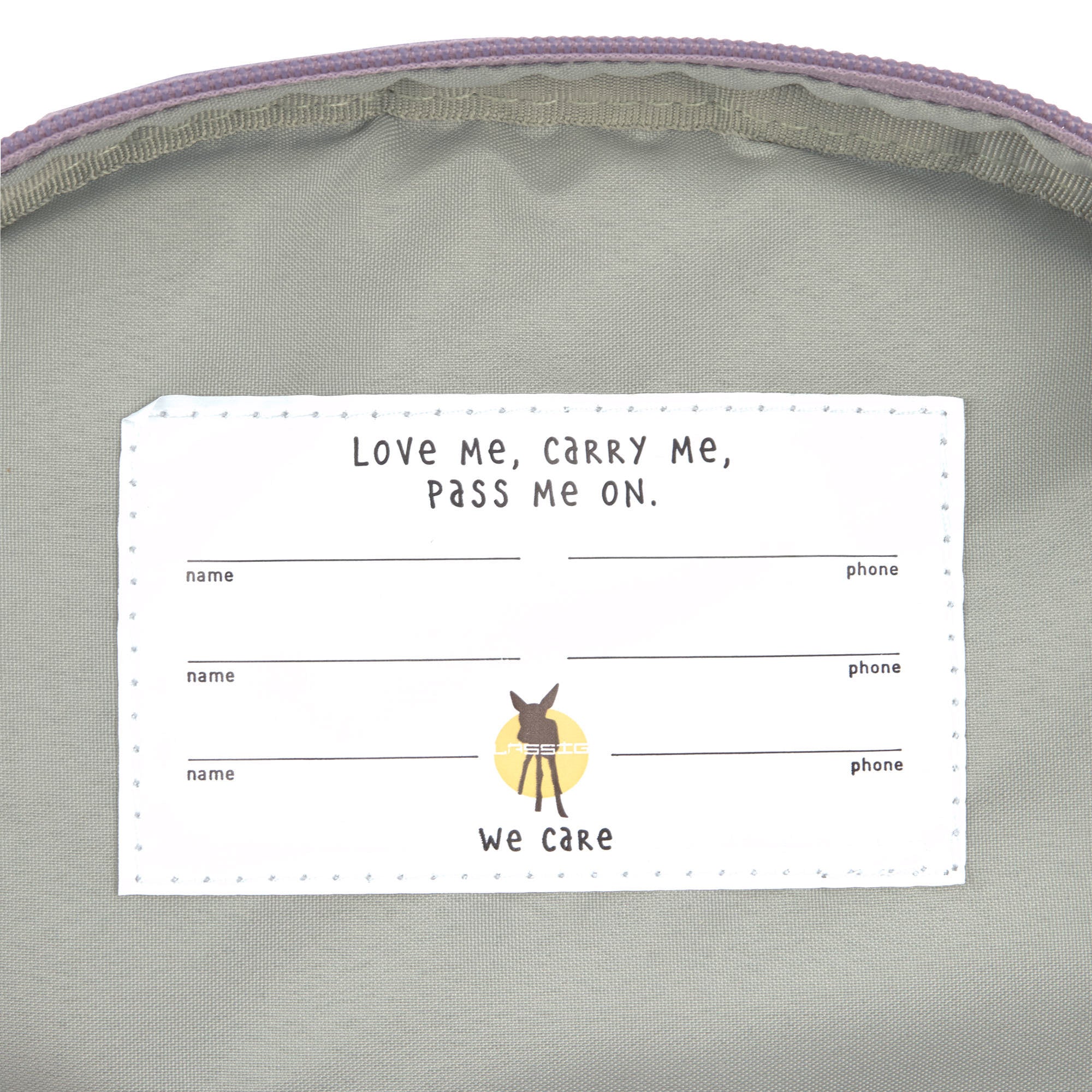 The inside label of the Lassig mini kids backpack with multiple spaces for names and phone numbers.