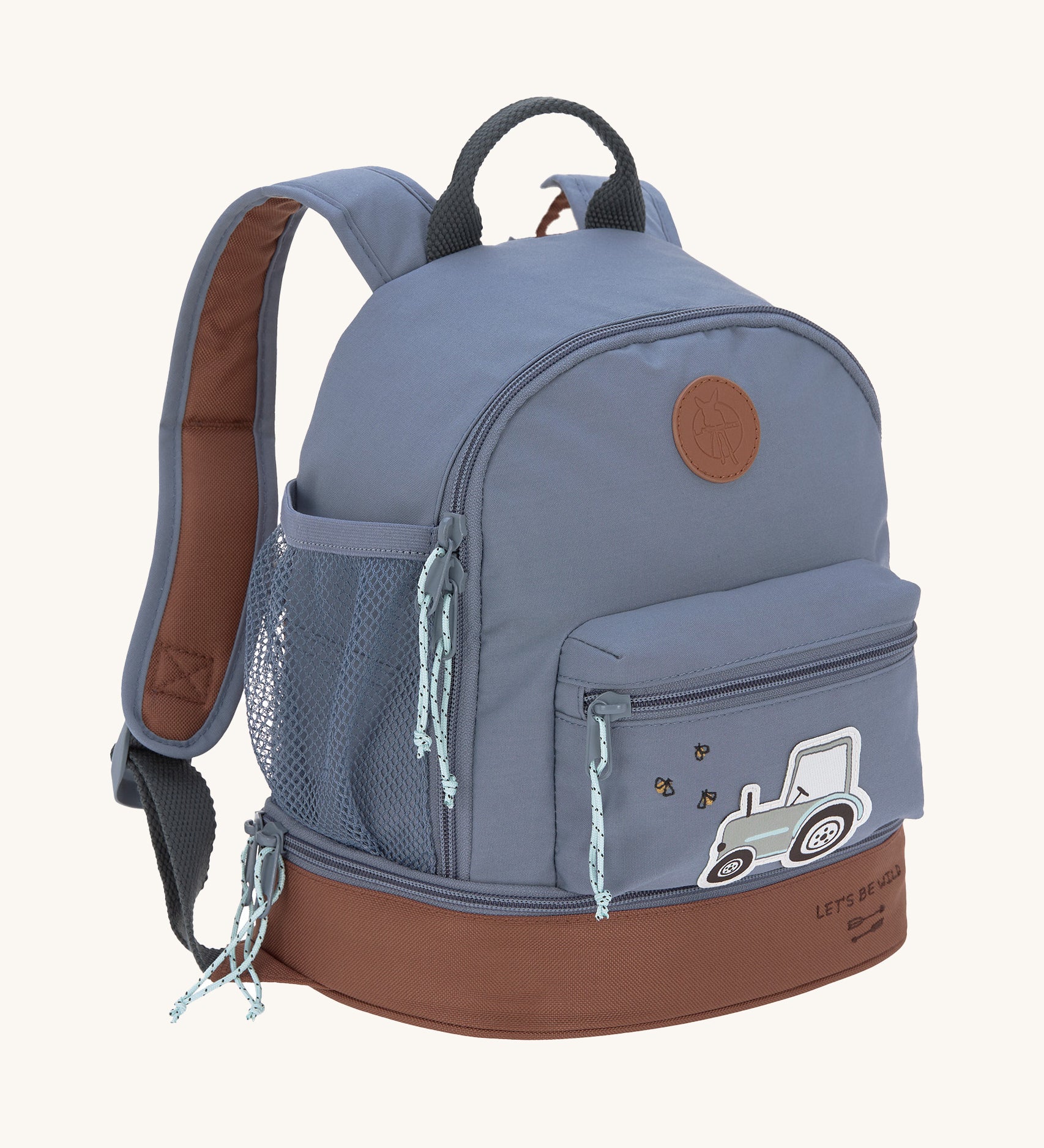 The Lassig mini backpack for kids, in a dark blue colour with a brown base and a little tractor design on the front pocket.