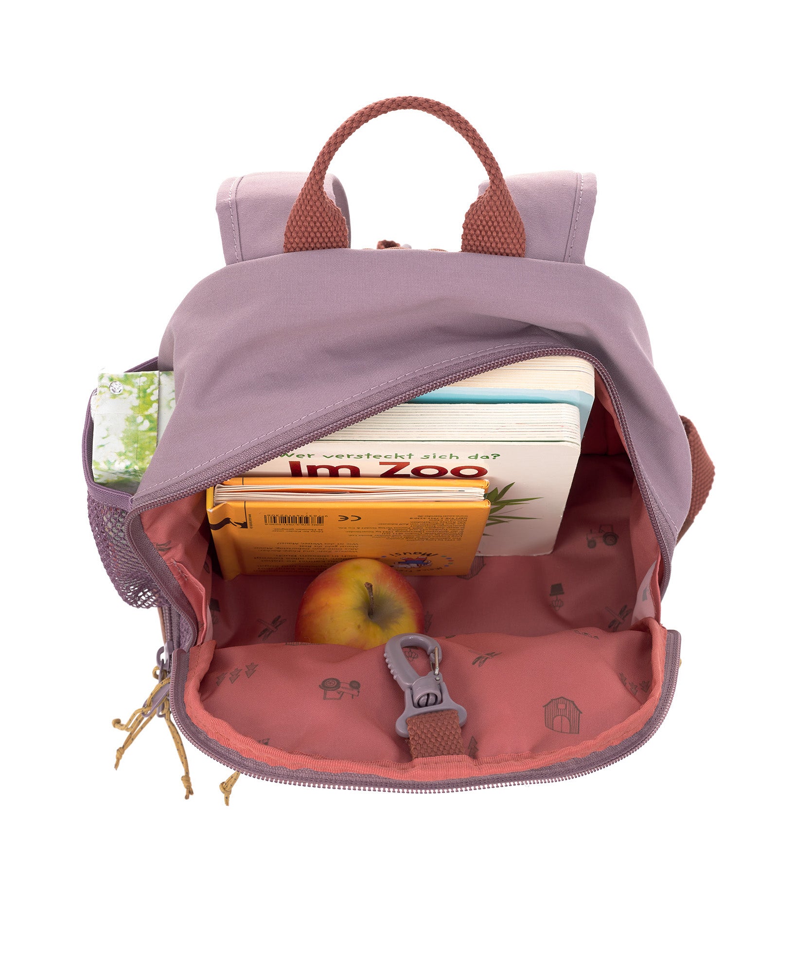 A view of the inside of the Lassig Kids Mini Backpack, showing the vast storage space and tractor pattern inside.