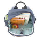 A view of the inside of the Lassig Kids Mini Backpack, showing the vast storage space and tractor pattern inside.