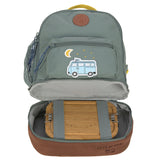 The Lassig kids mini adventure backpack in green, with the bottom compartment open revealing lunchbox storage space.