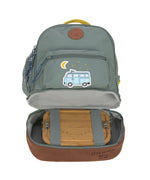 The Lassig kids mini adventure backpack in green, with the bottom compartment open revealing lunchbox storage space.