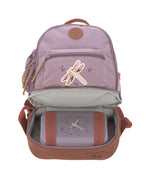 The Lassig mini backpack in lilac with a dragonfly on the front, with the bottom zip opened so you can see the opened bottom compartment, which is storing a lunch box.