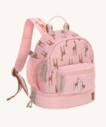 A Lassig mini backpack for kids in light pink, with giraffes printed all over.