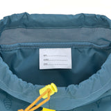 The inside name label of the Lassig kids mini outdoor backpack in Adventure Blue.