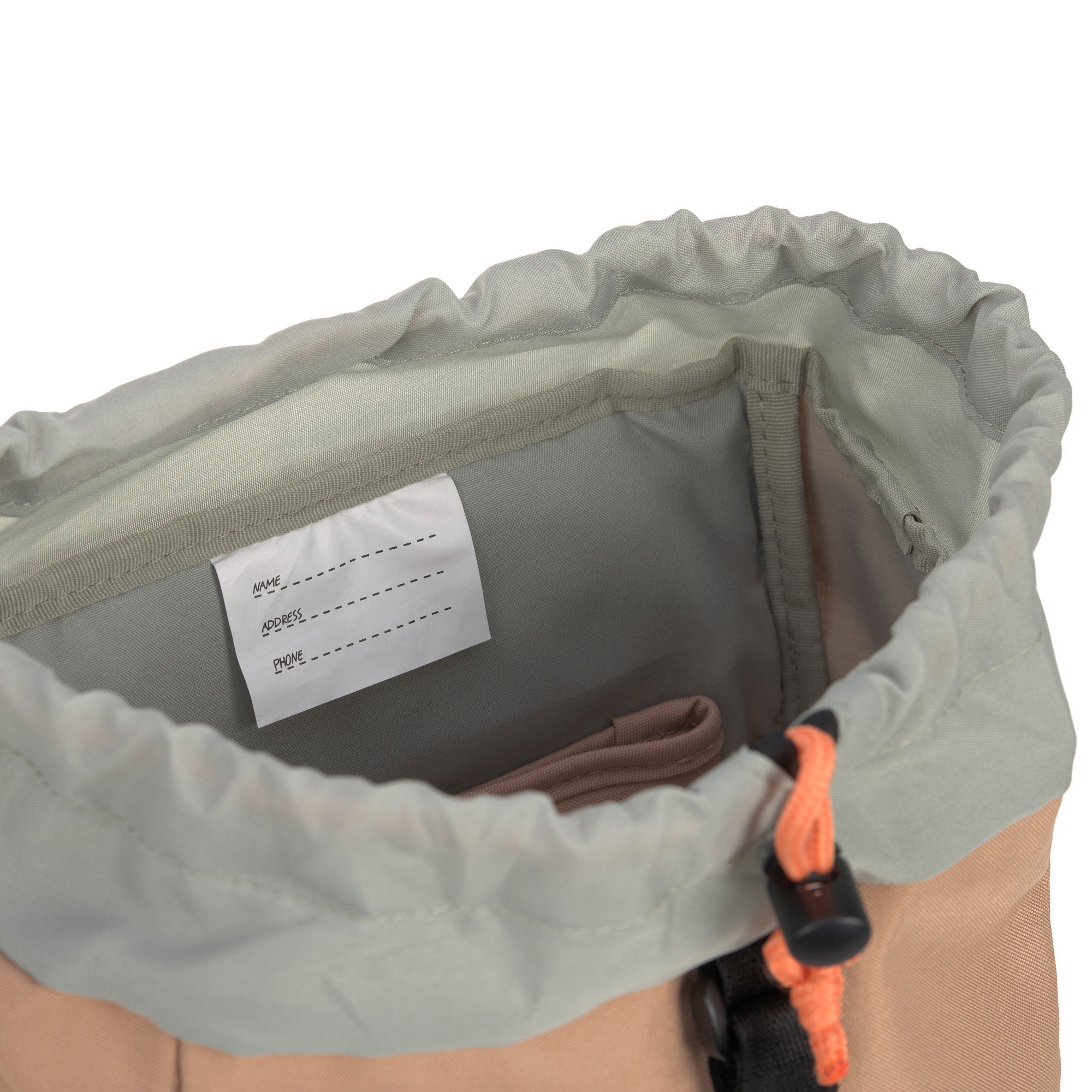 The inside name label on the Lassig kids mini outdoor backpack in hazelnut.