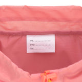 A close up of the name tag for the Lassig kids mini adventure backpack in rose.