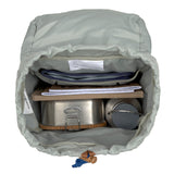 A top view of the inside of the Lassig kids mini outdoor backpack, showing that it has space for a lunchbox, water bottle, and school books.