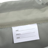 A closeup of the name label inside the Lassig kids outdoor mini backpack.