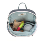 A top view of the Lassig tiny kids backpack in grey, with a toy, a cuddly animal, and a water bottle inside.