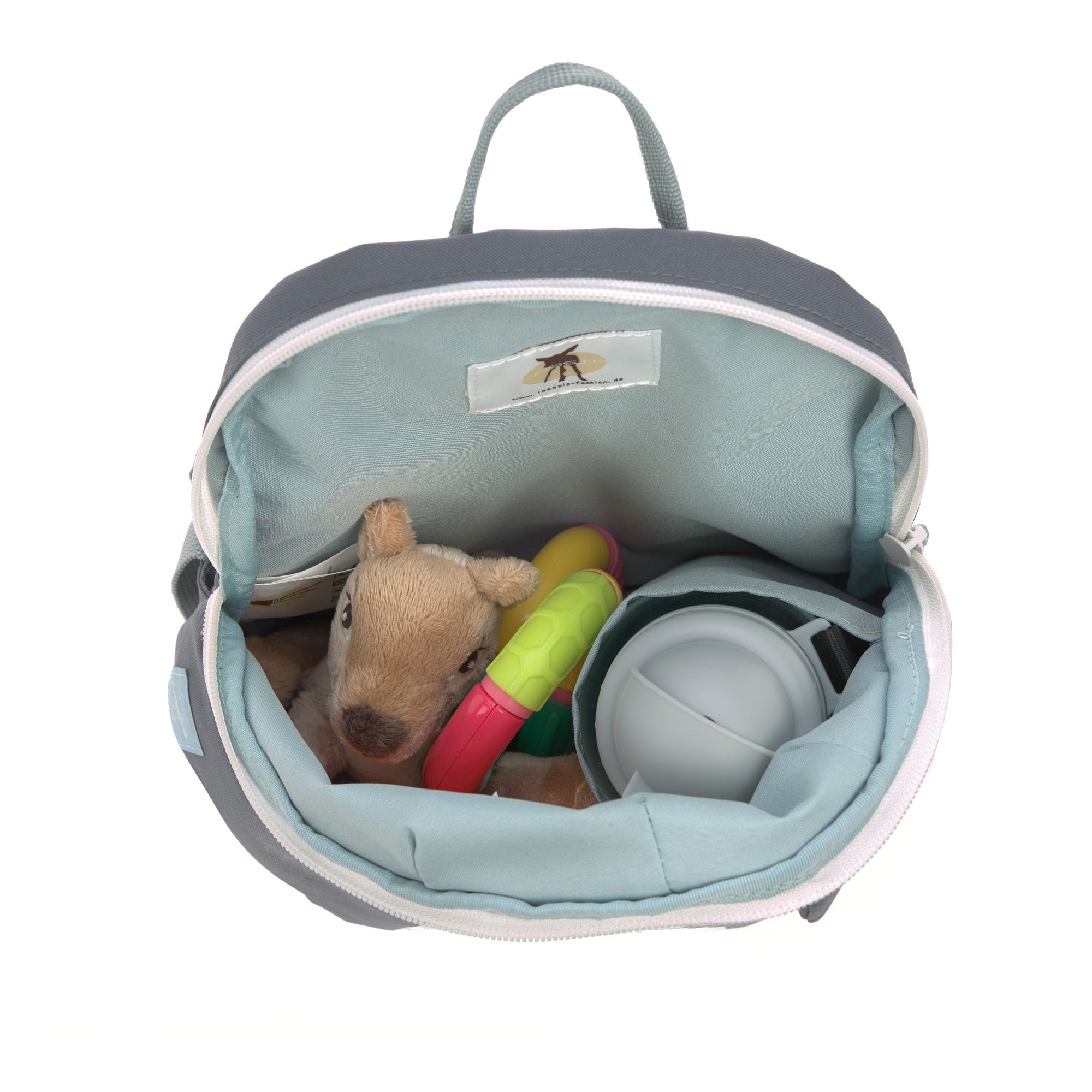 A top view of the Lassig tiny kids backpack in grey, with a toy, a cuddly animal, and a water bottle inside.