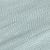 A closeup of the Lassig organic cotton muslin fabric, in a silver grey