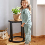 A little girl wearing the Lassig organic cotton muslin long sleeved shirt for babies and toddlers, in a silver grey