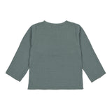The back of the Lassig organic cotton muslin long sleeved top for babies and toddlers, in a dark petrol green.