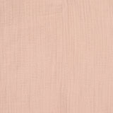 A closeup of the beautifully soft organic cotton muslin material, in a pale powder pink, from Lassig.