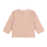 The back of the Lassig organic cotton muslin long sleeved top for babies and toddlers, in a beautiful pale powder pink colour.
