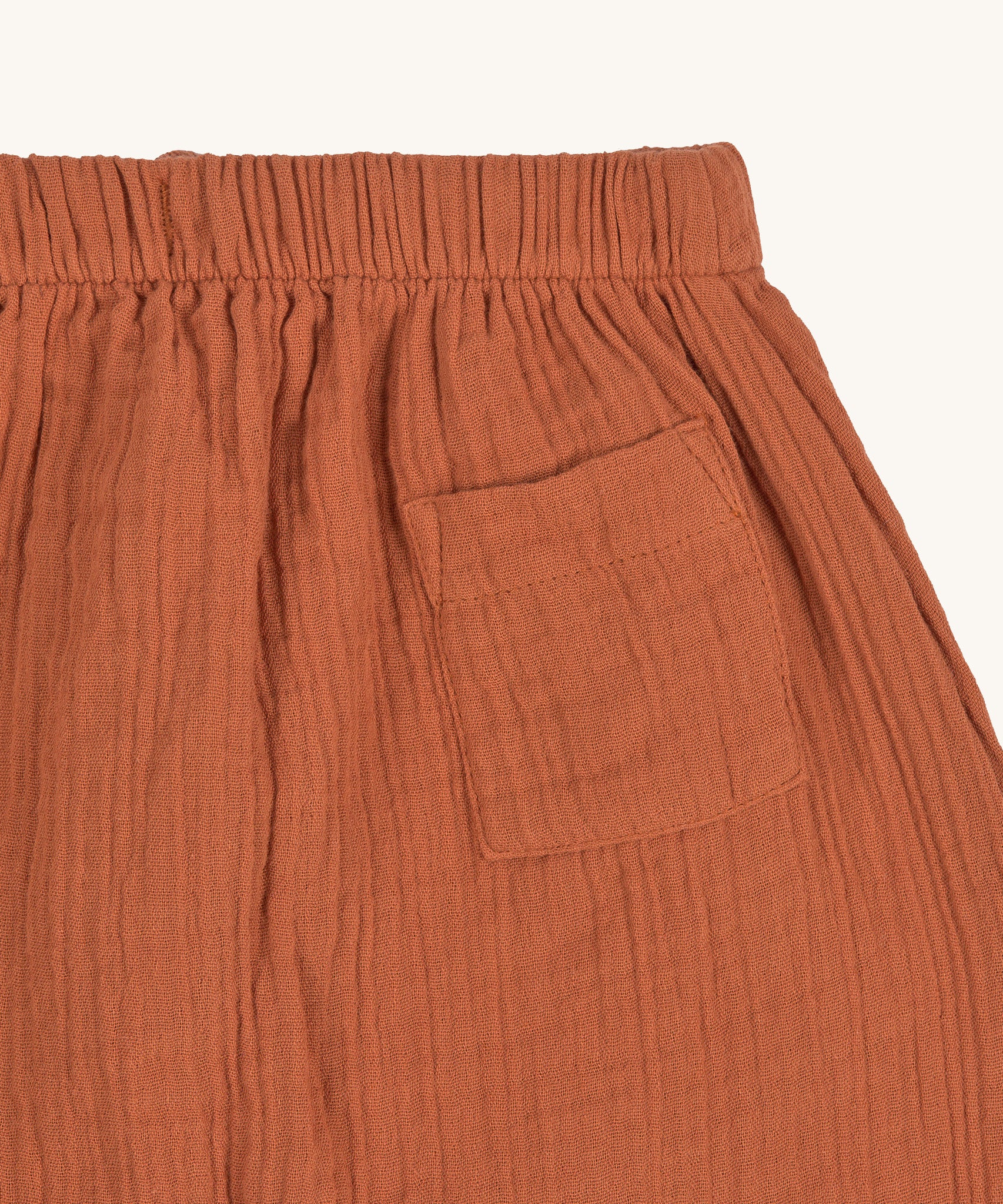 A closeup of the pocket detail on the Lassig organic cotton muslin pants.