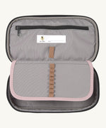 A close up of the inside of the Lassig spacy pink & navy pencil case showing the elasticated stationary holder detail and extra compartment with a zip fastener. Features a name tag on the inside