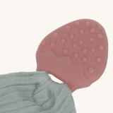 A closeup of the strawberry-shaped natural rubber teether.