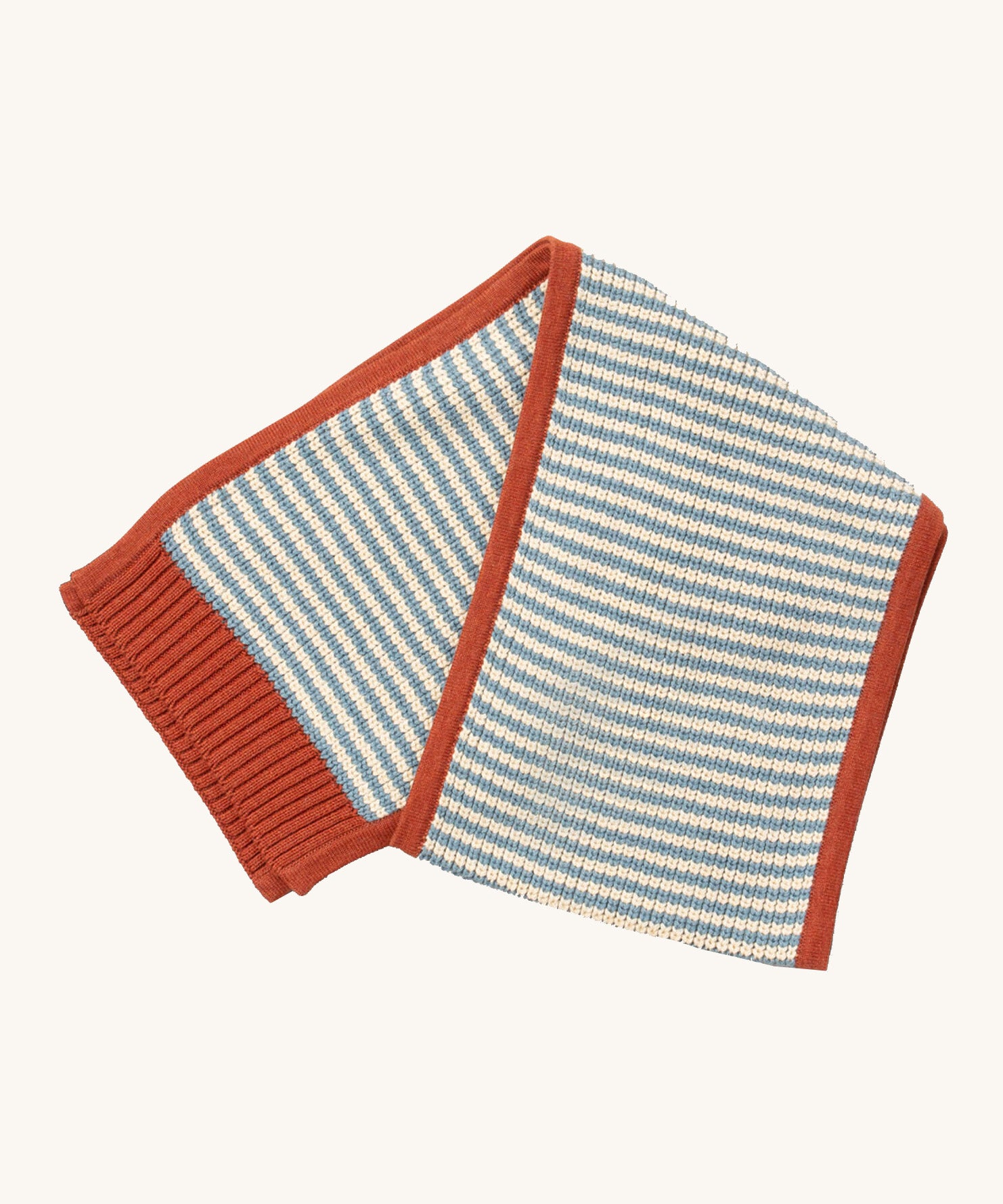 Little Green Radicals knitted scarf in blue stripes available at Babipur. A thick knitted GOTS organic cotton scarf in blue and cream stripes with a red trim