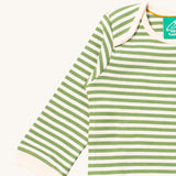 A close up of the striped Little Green Radicals baby body suit showing the light cream trim and the green and cream stripe detail on soft organic cotton fabric