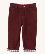 Little Green Radicals adventure jeans in chocolate corduroy available at Babipur. A soft GOTS organic cotton trousers in dark maroon with a check  design inner. It has a button fastener for a comfortable fit and 2 side pockets