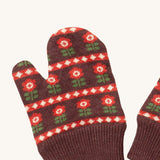 A close up of the Little Green Radicals collecting flowers mittens showing the retro red flower design on dark brown organic cotton fabric