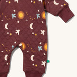 A close up of the Little Green Radicals hooded snug suit in flying birds showing the arm and leg cuff detail