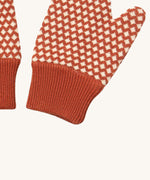 A close up of the Little Green Radicals ginger diamond mittens showing the diamond design and elasticated cuff detail on organic cotton fabric