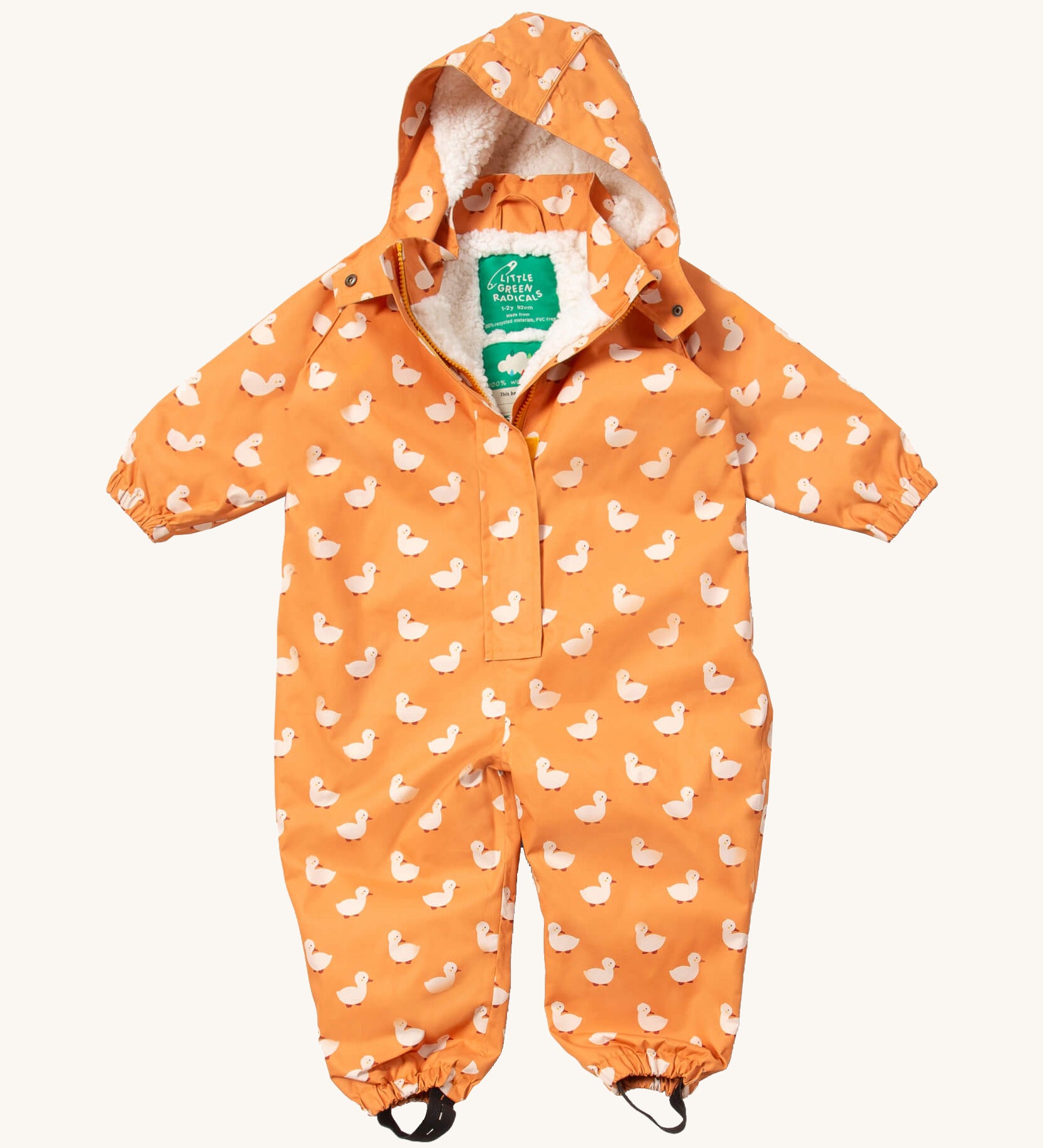 Little Green Radicals gold ducks waterproof winter suit  available at Babipur. A recycled polyester thick all in one outfit in yellow with cute prints of ducks. Features a hood, a white sherpa fleece inner liner, elasticated cuffs and black straps on the legs to go over footwear.