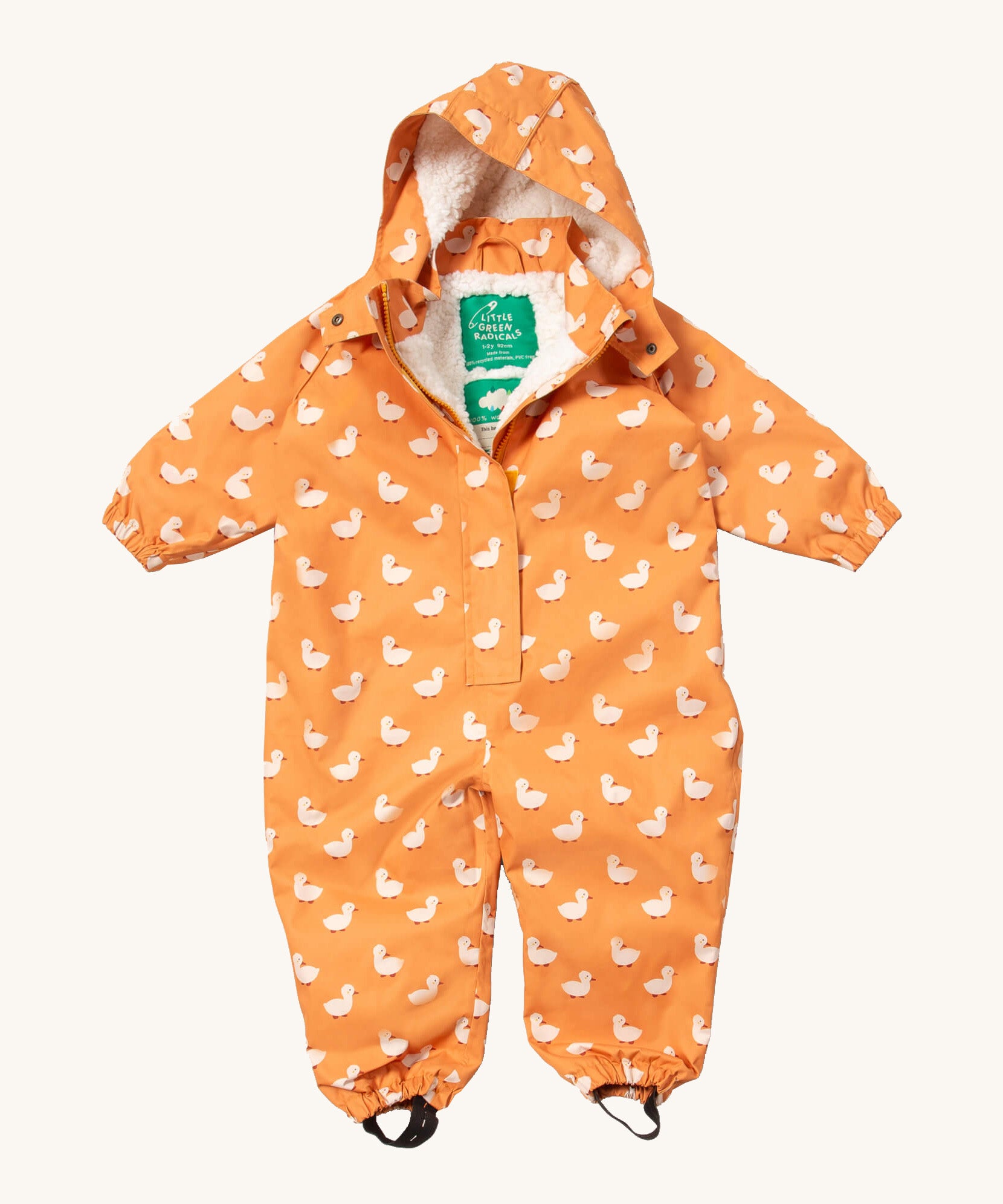 Little Green Radicals gold ducks waterproof winter suit  available at Babipur. A recycled polyester thick all in one outfit in yellow with cute prints of ducks. Features a hood, a white sherpa fleece inner liner, elasticated cuffs and black straps on the legs to go over footwear.