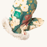 A close of the Little Green Radicals sherpa fleece mittens in hedgerow. Showing a close up of the squirrel print and soft elasticated cuff around the wrist for a secure fit  on turquoise organic cotton fabric. Features a brand patch on the mitten