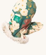 A close of the Little Green Radicals sherpa fleece mittens in hedgerow. Showing a close up of the squirrel print and soft elasticated cuff around the wrist for a secure fit  on turquoise organic cotton fabric. Features a brand patch on the mitten