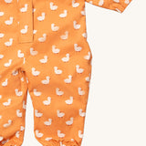 A close up of the Little Green Radicals gold ducks waterproof winter suit. Showing the elasticated cuffs detail for a snug fit on yellow recycled polyester fabric