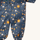 A close up of the Little Green Radicals night moon waterproof winter suit. Showing the elasticated cuffs detail for a snug fit on navy recycled polyester fabric