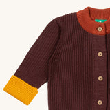 A close up of the Little Green Radicals knitted cardigan in chocolate showing the button detail and a close up collar and cuff detail on brown  GOTS organic cotton fabric and available at Babipur.