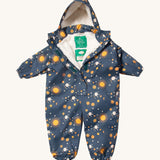 Little Green Radicals night moon waterproof winter suit  available at Babipur. A recycled polyester thick all in one outfit in navy with a cute starry night print. Features a hood, a white sherpa fleece inner liner, elasticated cuffs and black straps on the legs to go over footwear.