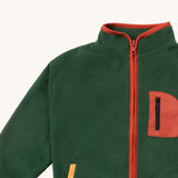 A close up of the Little Green Radicals polar fleece jacket in olive showing the turned up collar and red trim detail. Features a full length zip detail on dark green recycled polyester fabric.