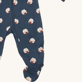 A close up of the Little Green Radicals navy sheep  baby grow, showing the zipper fastener detail and built in feet feature