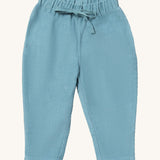 Little Green Radicals comfy trousers in pale blue corduroy available at Babipur. A soft GOTS organic cotton trousers in blue with elasticated waistband for a comfortable fit and a matching drawstring.