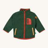 Little Green Radicals polar fleece jacket in olive available at Babipur. A dark green recycled polyester fleece with red trim. Features a chest and 2 side pockets and a camp fire appliqué patch on the left shoulder