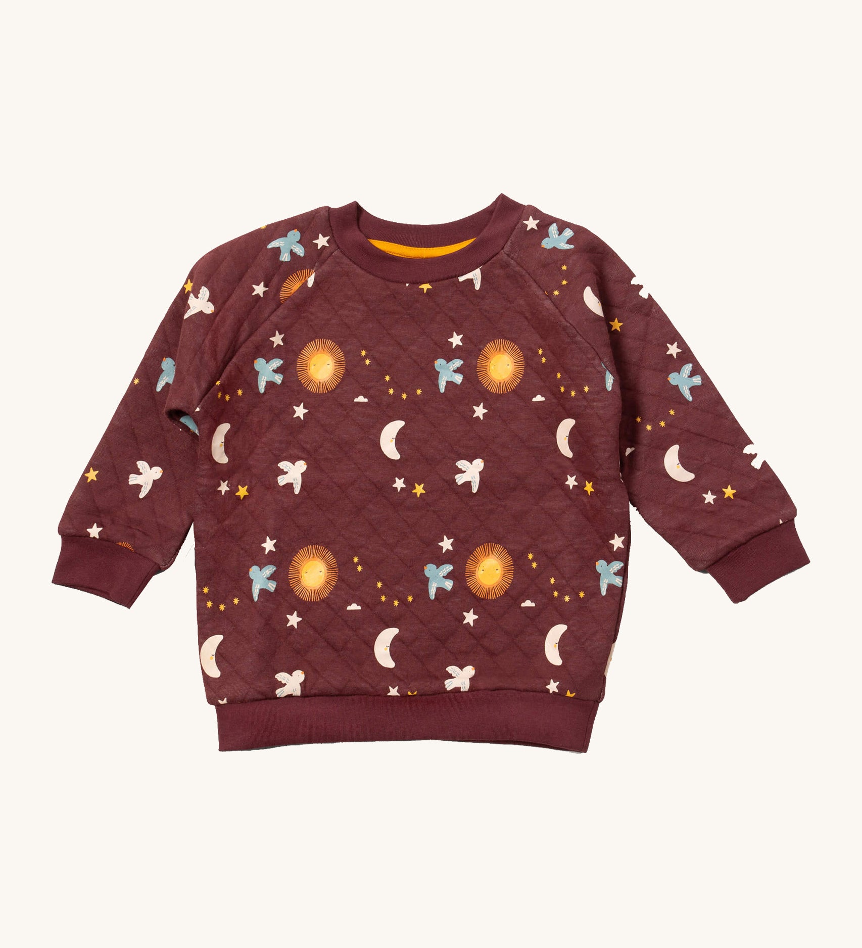 Little Green Radicals flying birds quilted sweatshirt available at Babipur. A GOTS organic cotton sweatshirt in dark maroon with quilted indents. Features cute prints of birds flying through a starry night.