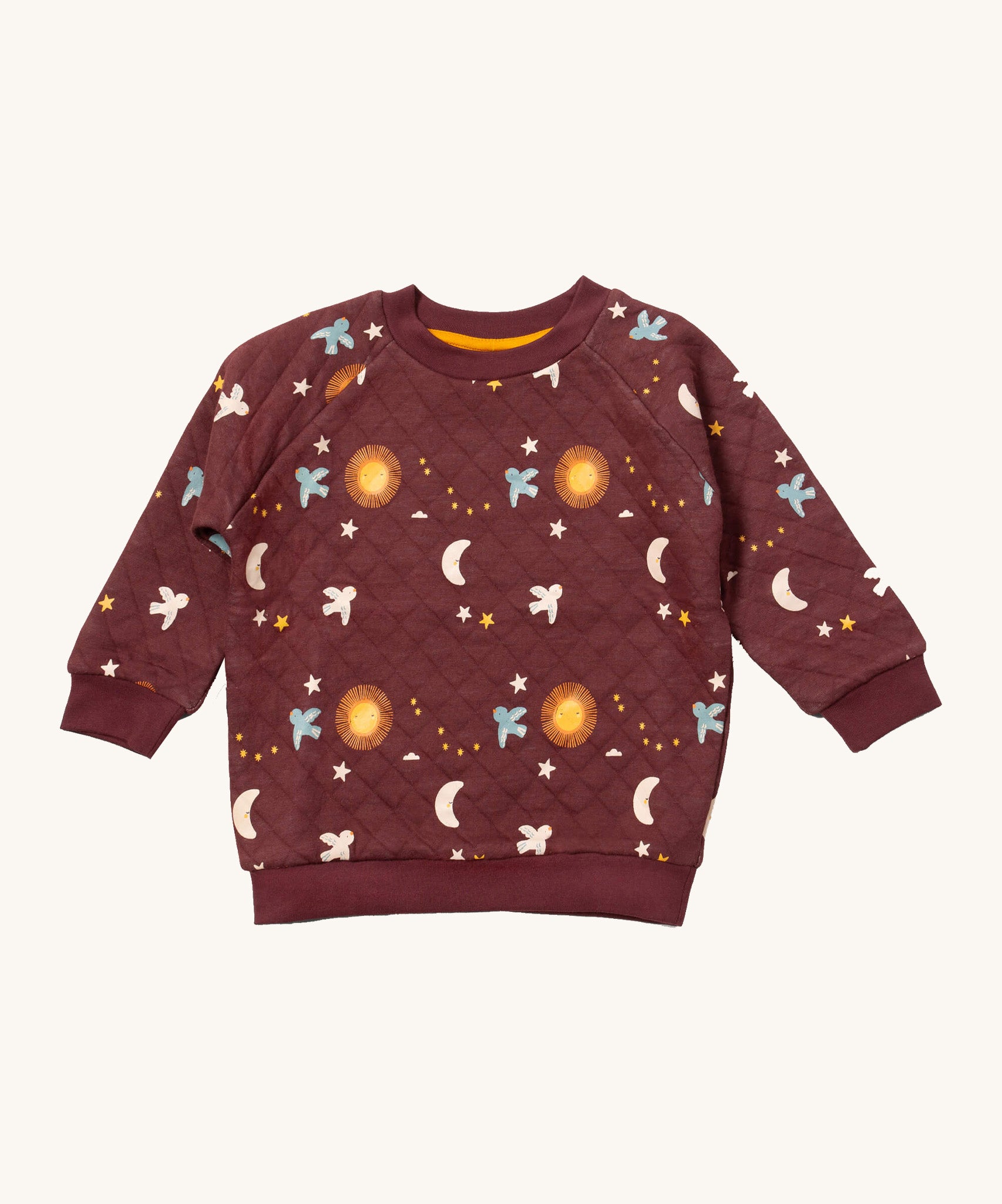 Little Green Radicals flying birds quilted sweatshirt available at Babipur. A GOTS organic cotton sweatshirt in dark maroon with quilted indents. Features cute prints of birds flying through a starry night.