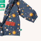 A close up of the Little Green Radicals waterproof coat in night moon showing the elasticated cuff detail on navy recycled polyester fabric