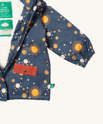 A close up of the Little Green Radicals waterproof coat in night moon showing the elasticated cuff detail on navy recycled polyester fabric